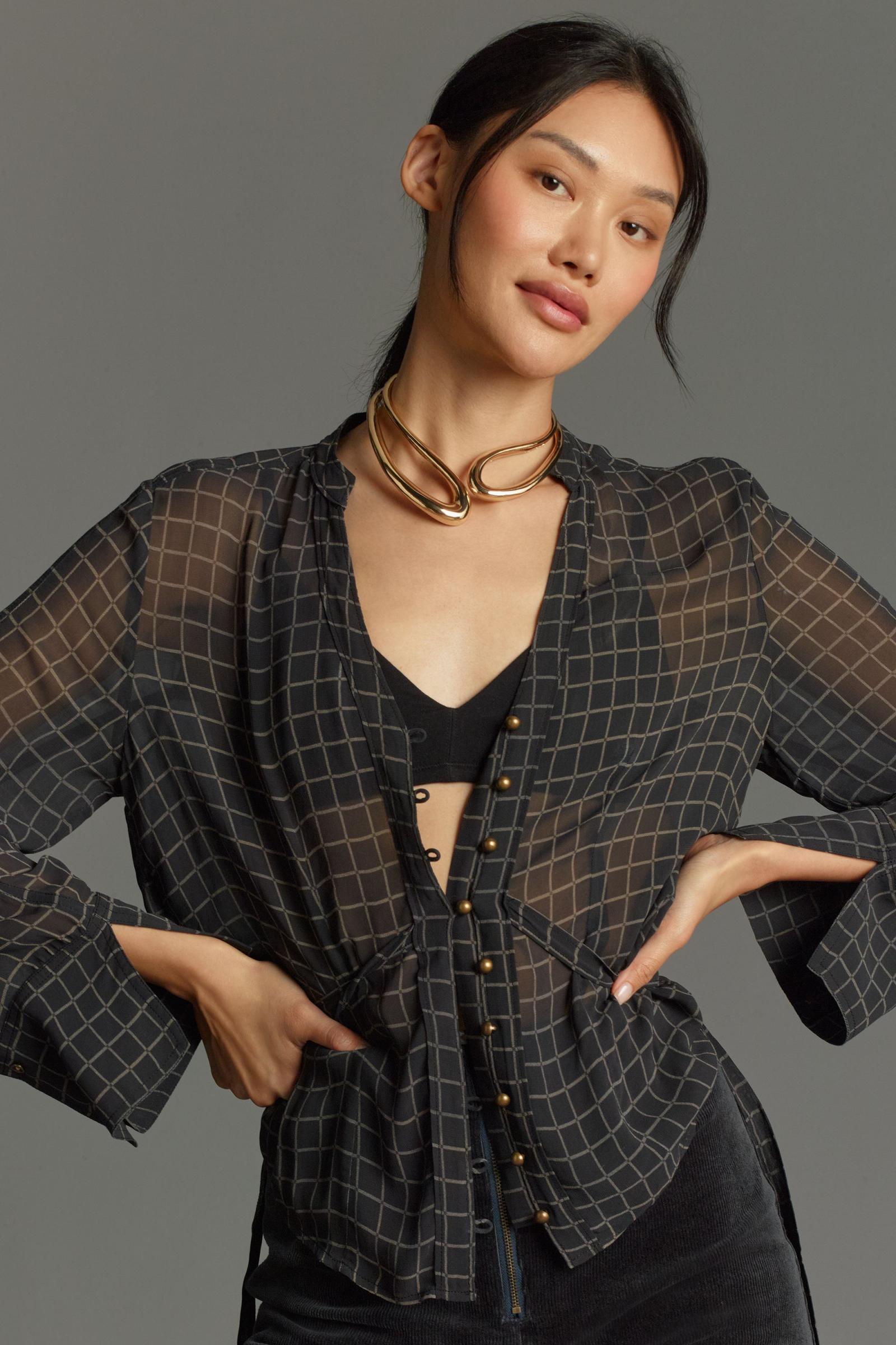 Motif chain over sheer shirt