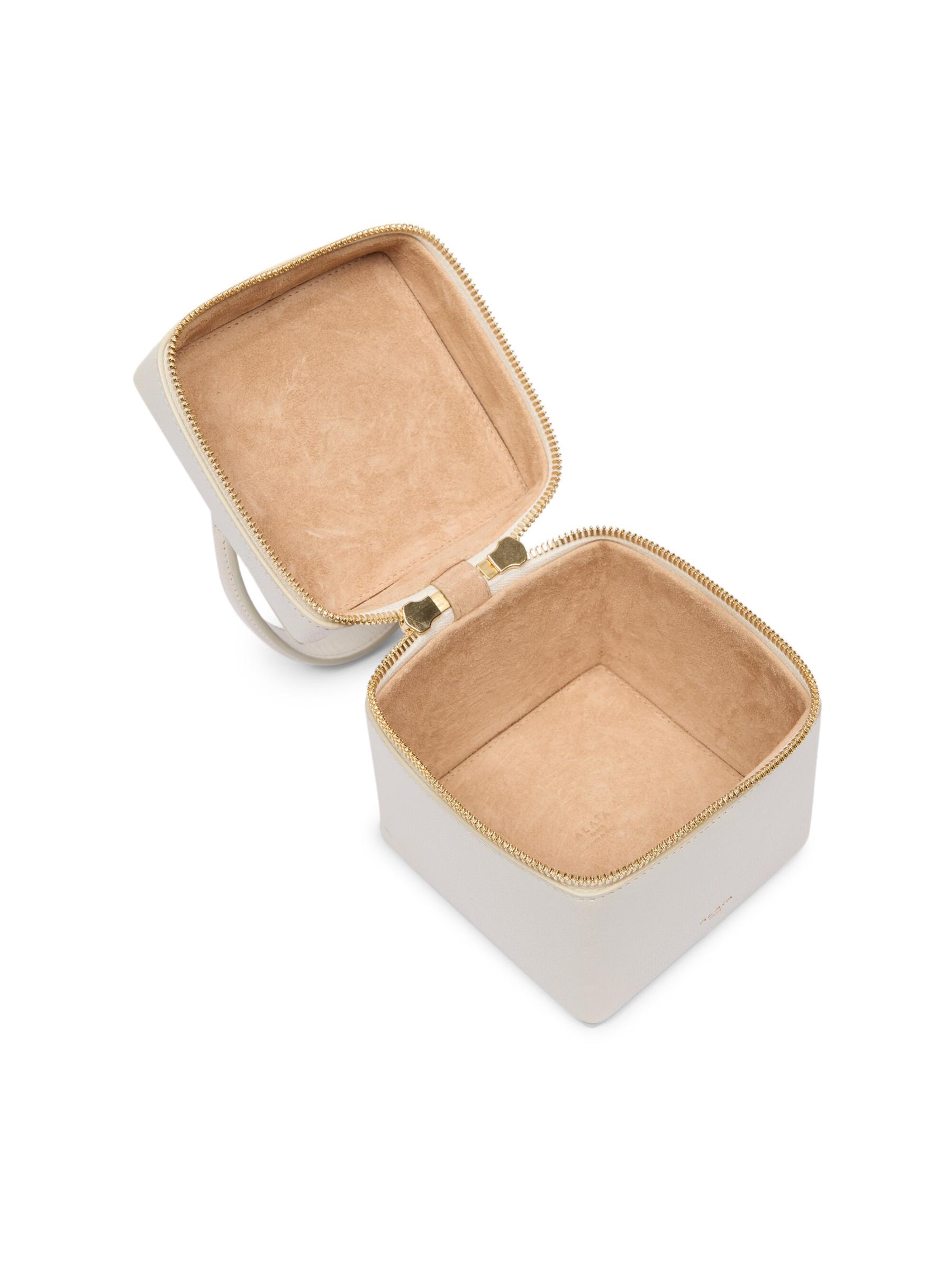 【パーティーの主役級】ALAIA CUBE Shiny Goatskin Vanity Case Cube leather vanity bag in black - Alaia | Mytheresa