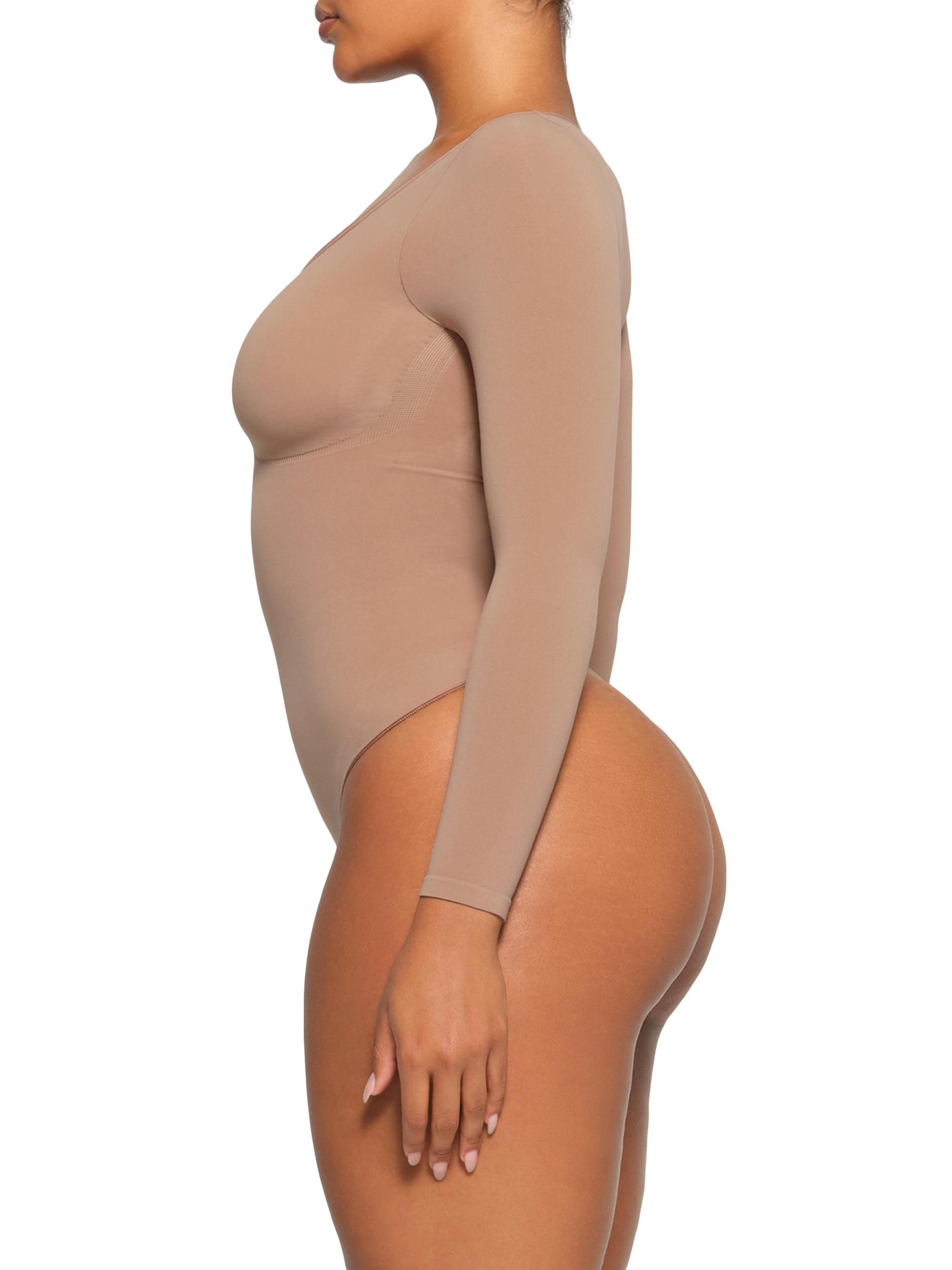 Shop SKIMS - Seamless Sculpt Long Sleeve Thong Bodysuit | Saks