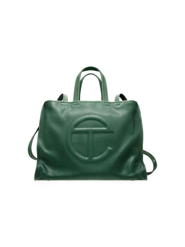 حقيبة جلدية كبيرة تحمل شعار الحمل