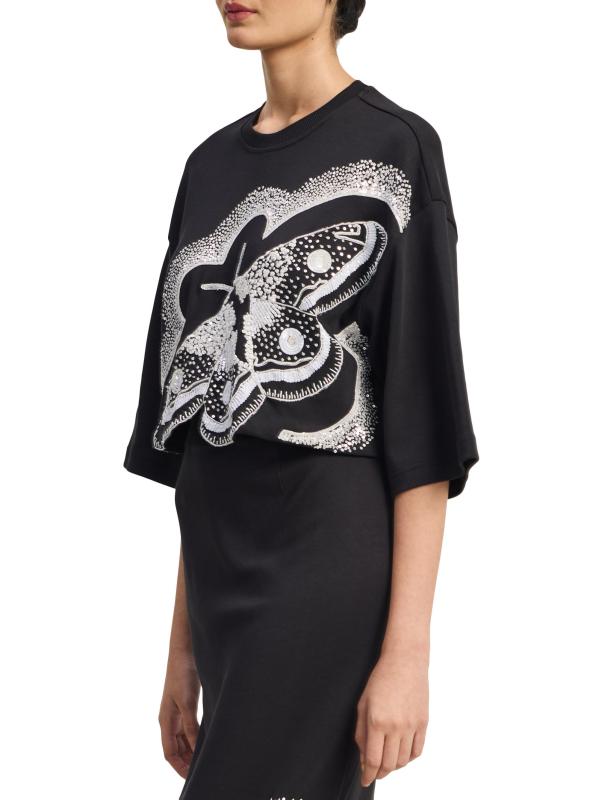 #5: بلوزة قصيرة مزيّنة بالترتر على شكل فراشة - أسود